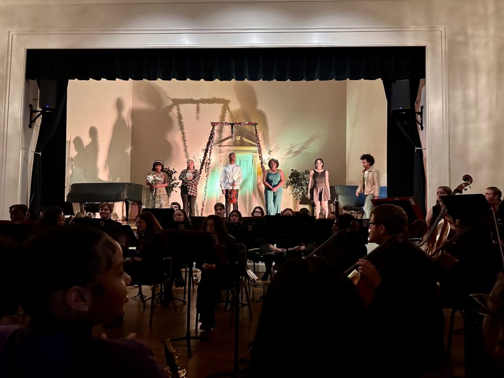 CC stage performers, orchestra in the forefront