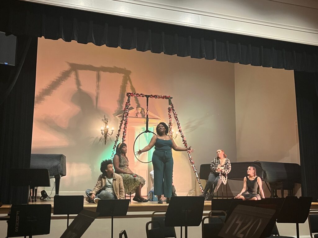 performer singing on stage