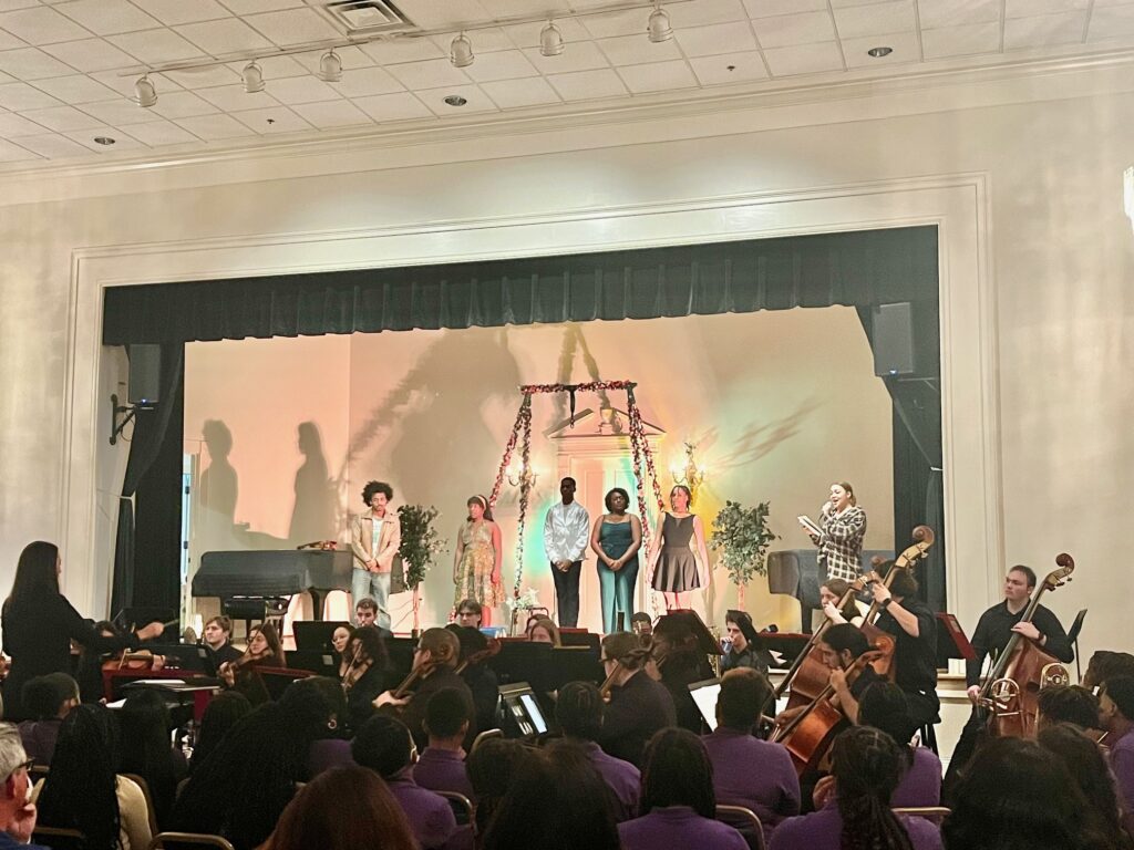 orchestra with performers on stage