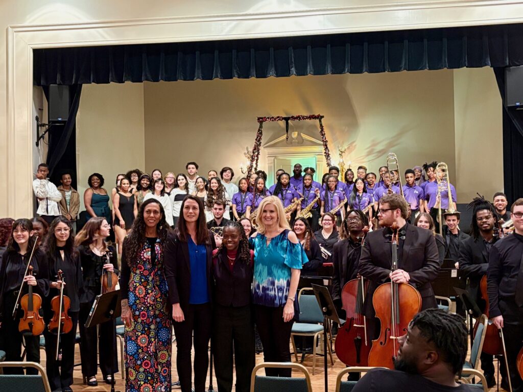 performers, orchestra and Tru and Maureen pose for pictures